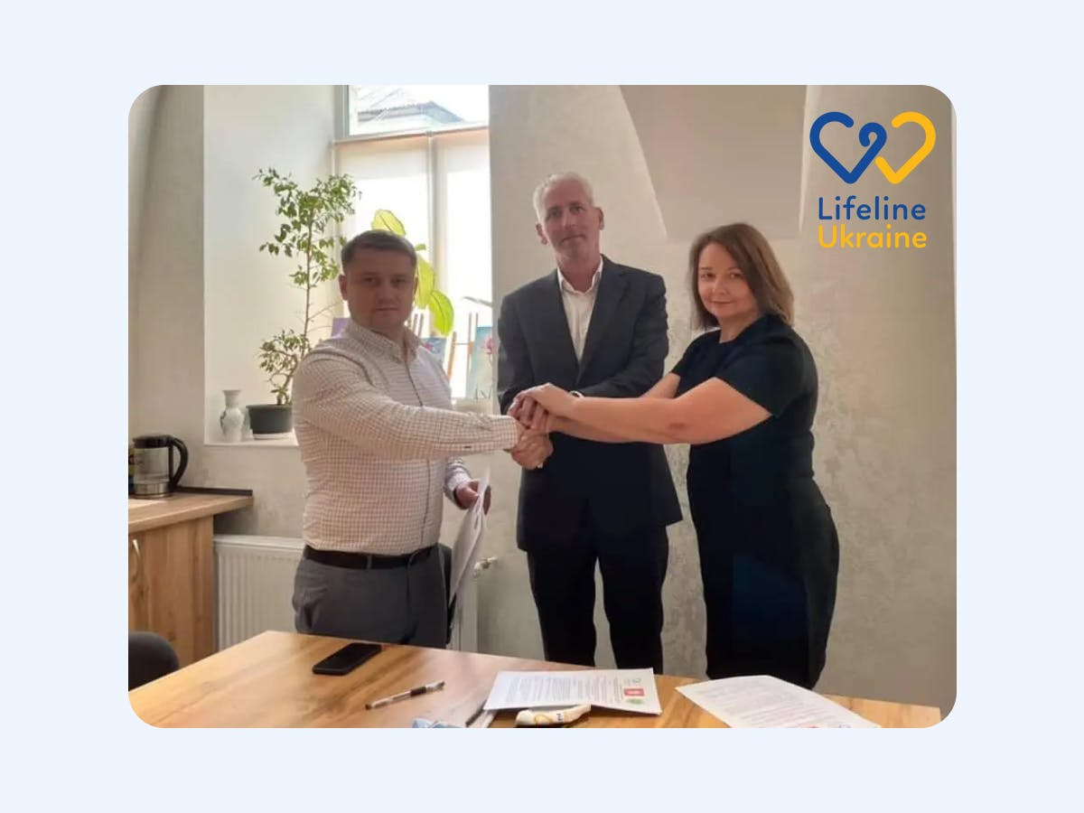 Pictured: Paul Nyland, Oleksandr Tretiak and Tatyana Vorontsova signing a trilateral memorandum with LifeLine Ukraine