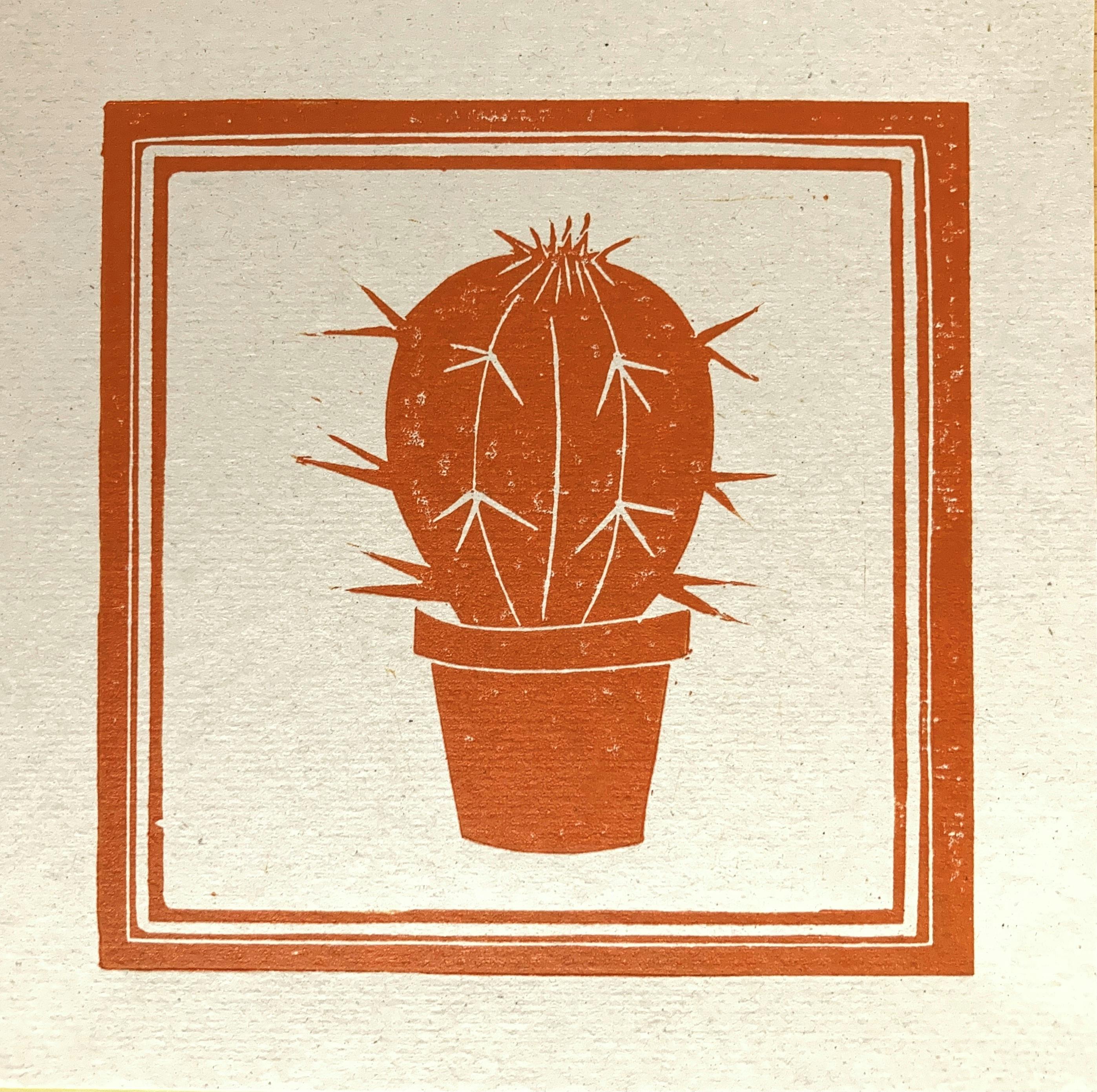 Image shows a print of an orange cactus in a frame