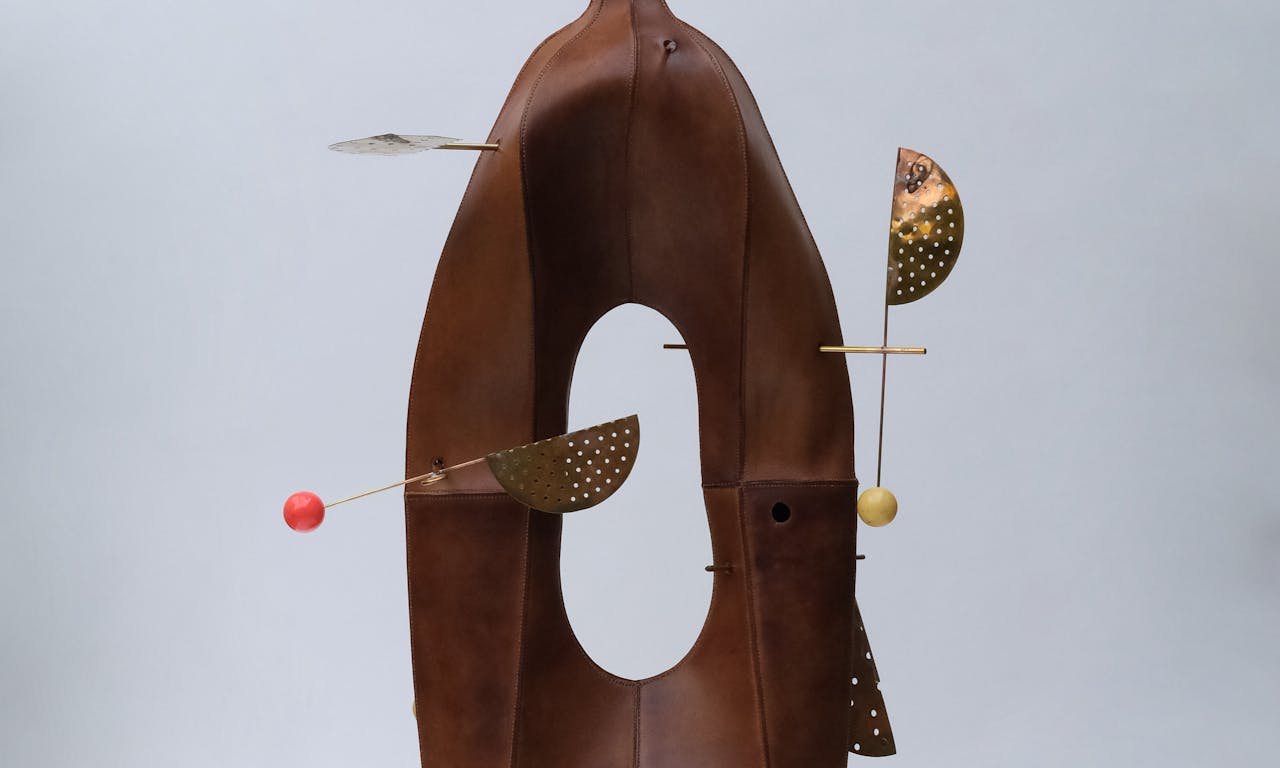 Frances Pinnock (b. 1990) Dress for the job you want (Accoutrements and Illuminations), 2023, Leather, brass objects, snooker balls, hemp, beeswax © Frances Pinnock, photo