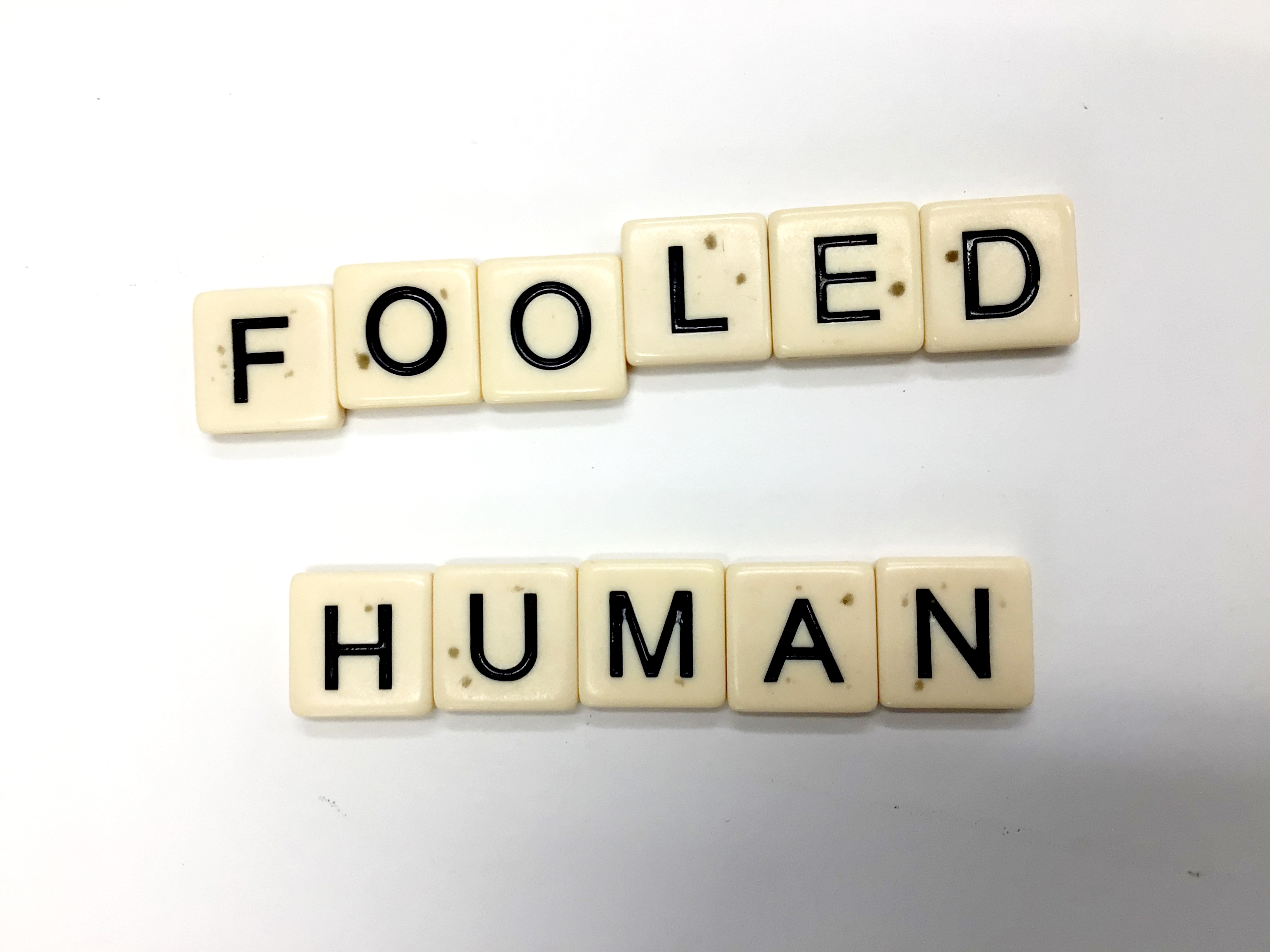 Scrabble letters reading Fooled Human