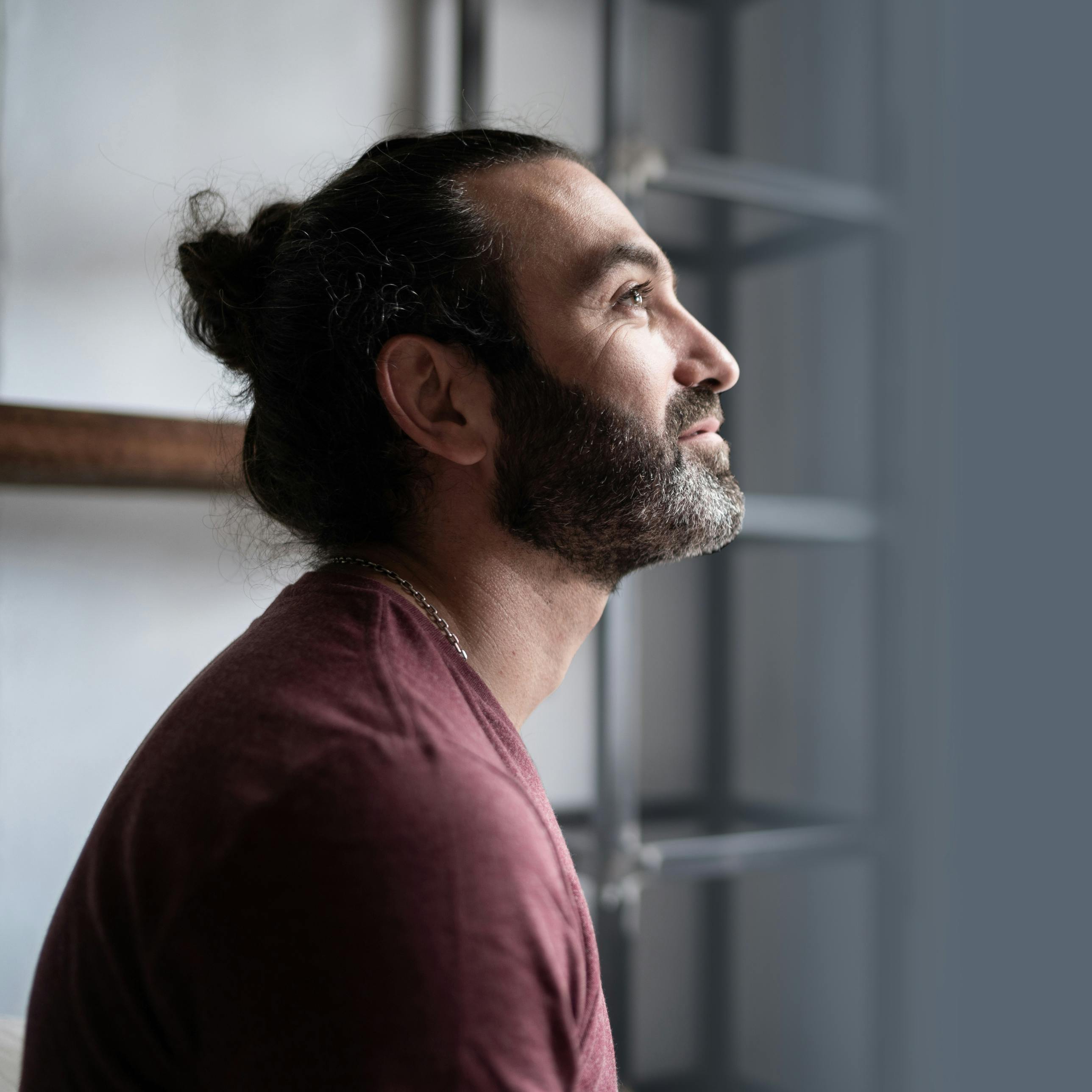 Man looking out the window