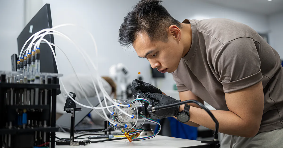 person working on a MedTech device