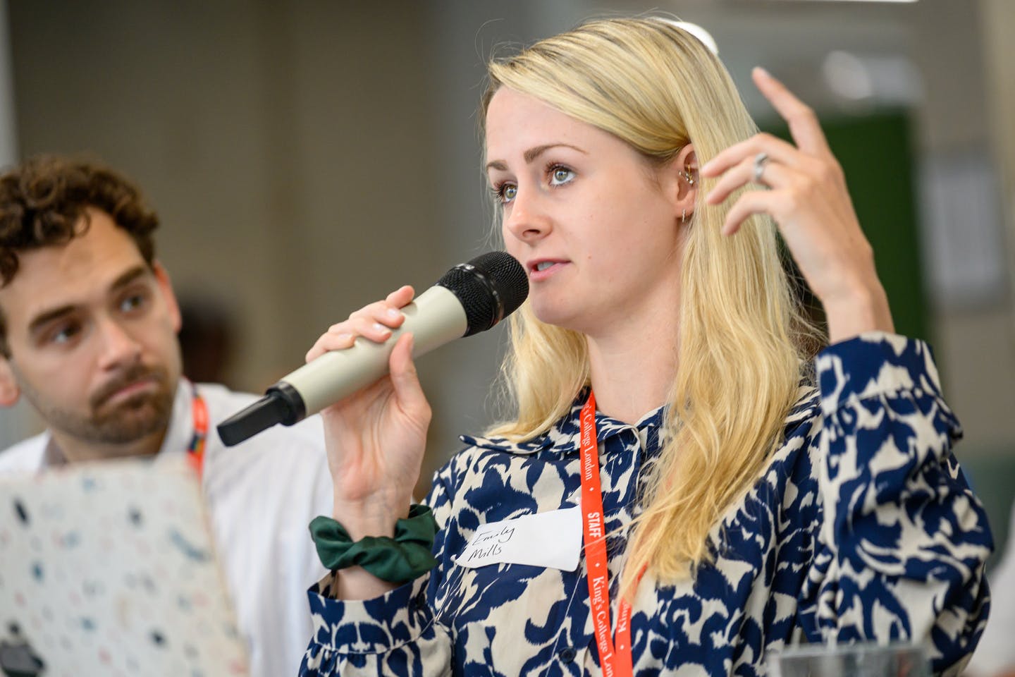 Female entrepreneur speaking on microphone