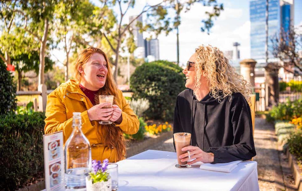A Like Family Social Carer and Member enjoying a hot chocolate together
