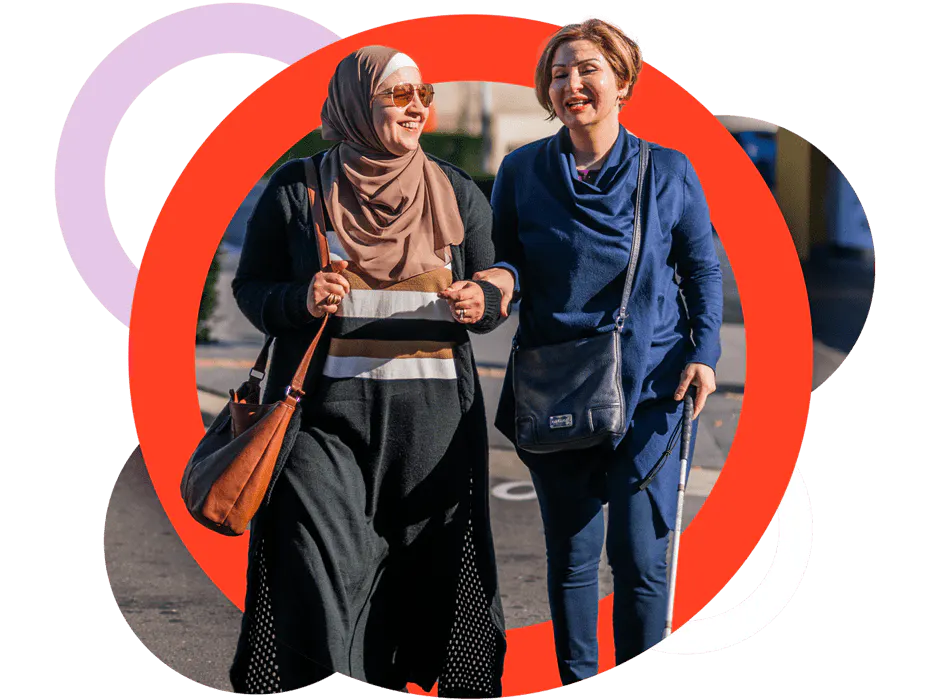 A Like Family Carer and Member walking with their arms linked