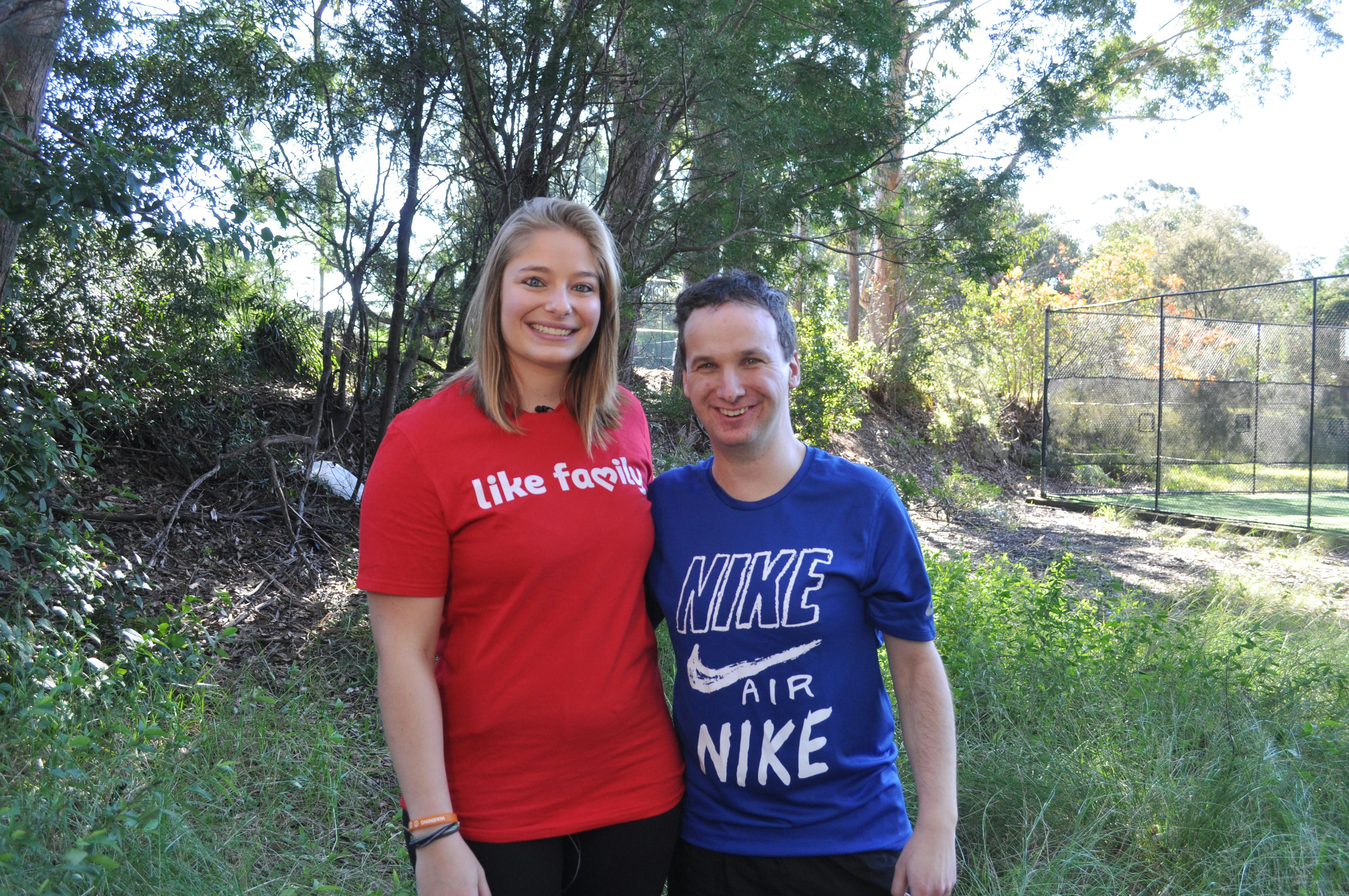 A Like Family Social Carer and Member standing in front of a tennis court