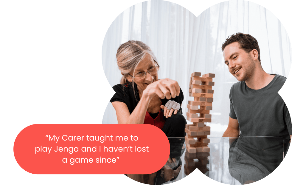 Member and Carer sitting down playing Jenga, with a quote next to it: "My Carer taught me to play Jena and I haven't lost a game since"