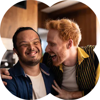 Like Family member and support worker laughing together