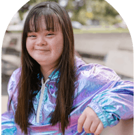 Young girl sitting and smiling