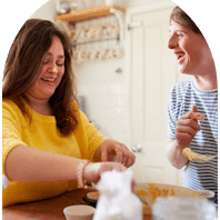 Two people baking together.