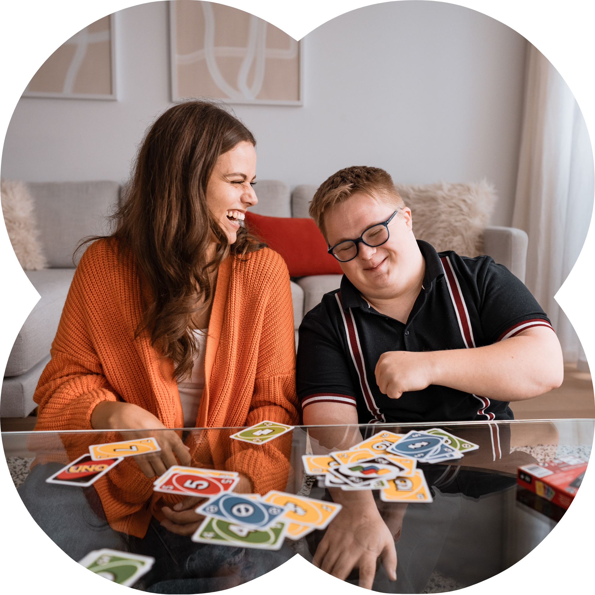 Like Family member playing uno with a support worker