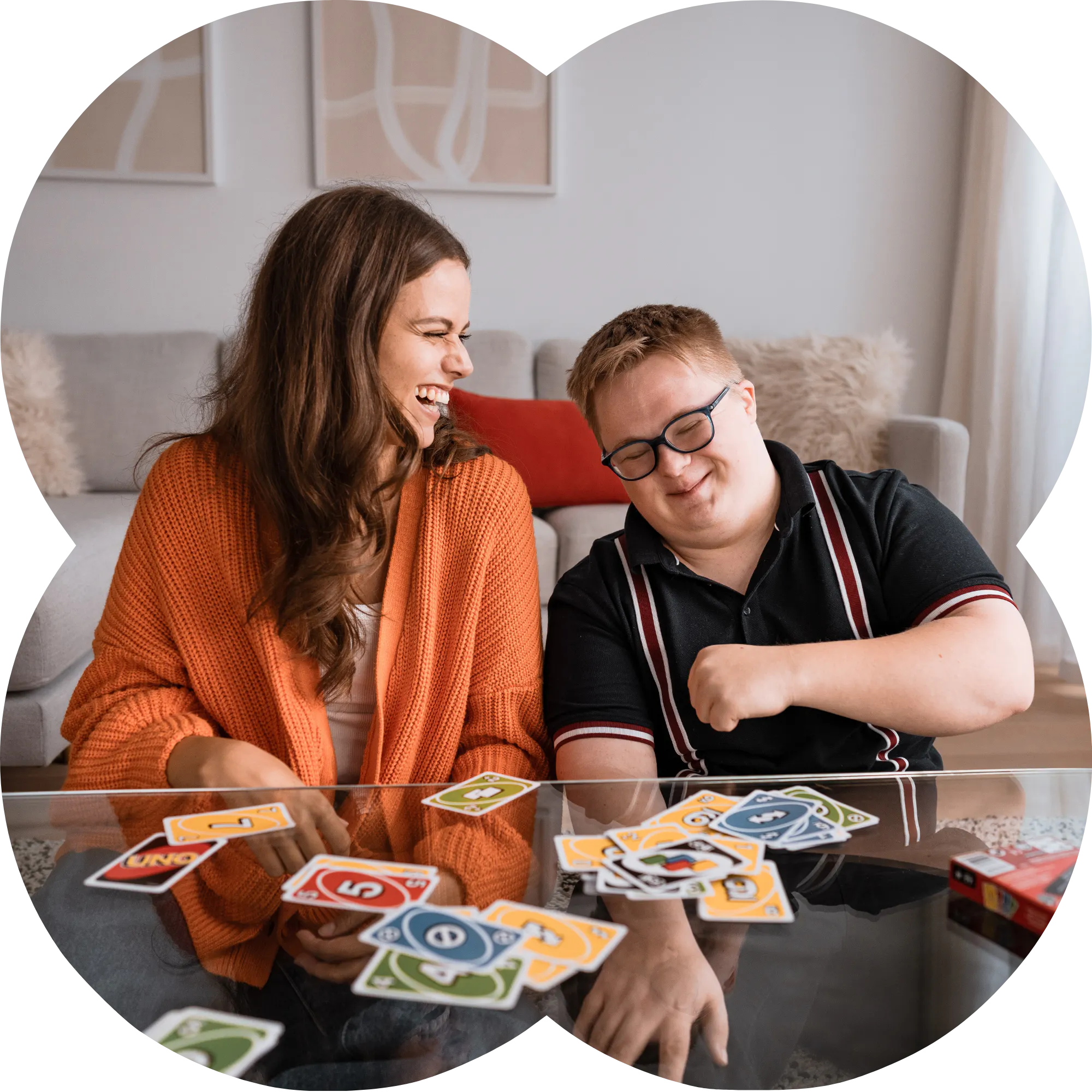 Like Family member playing uno with a support worker