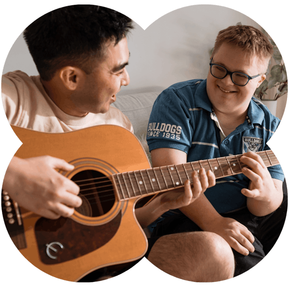 Like Family support worker playing guitar with a NDIS participant