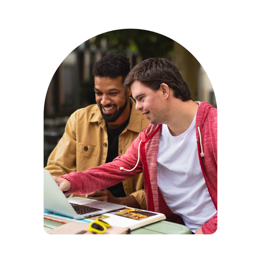 Member and Carer using a laptop together