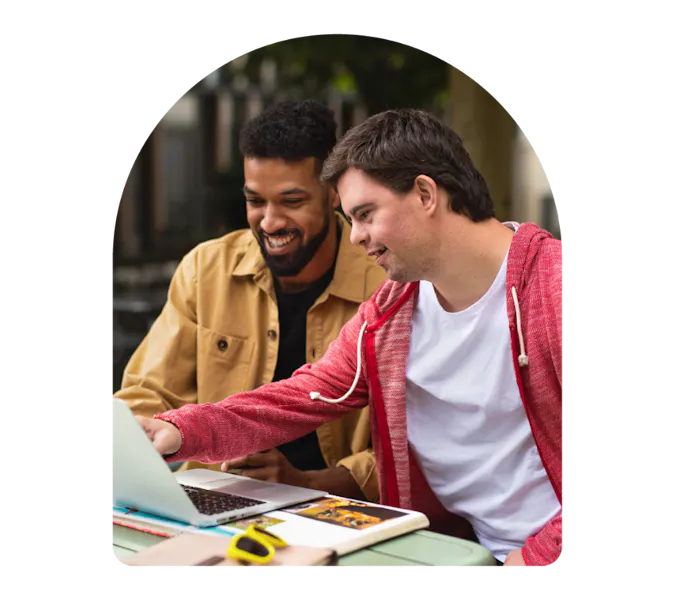 Member and Carer using a laptop together