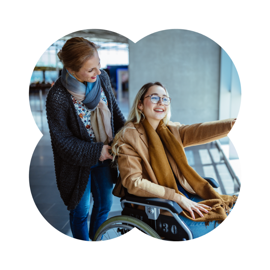 A Like Family Carer and Member in a wheelchair out in the community
