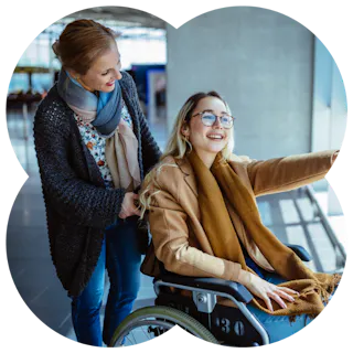 A Like Family Carer and Member in a wheelchair out in the community