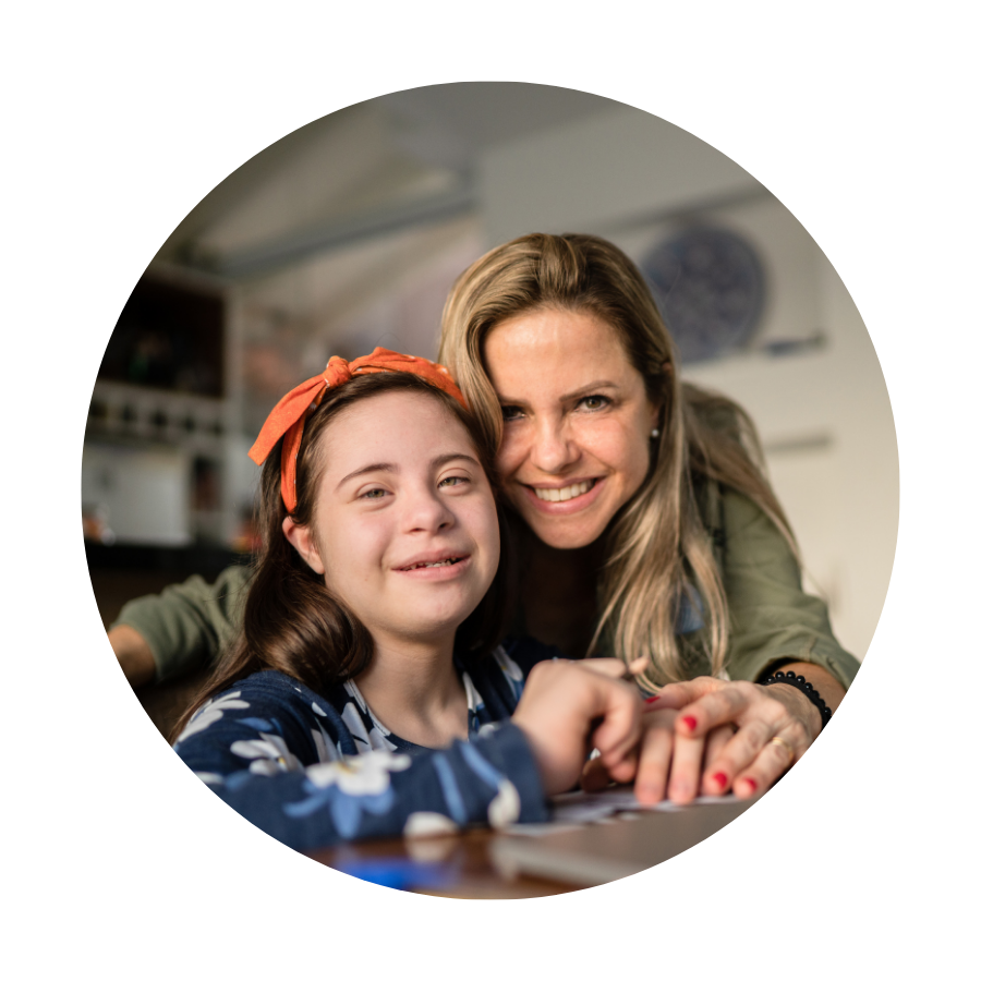 A Like Family Member (child) and their mum smiling at the camera