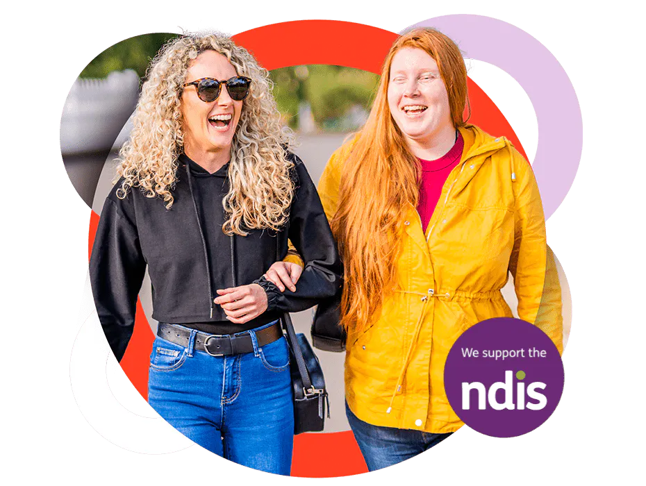 A Like Family Social Carer and Member with their arms linked next to a "we support the NDIS" logo