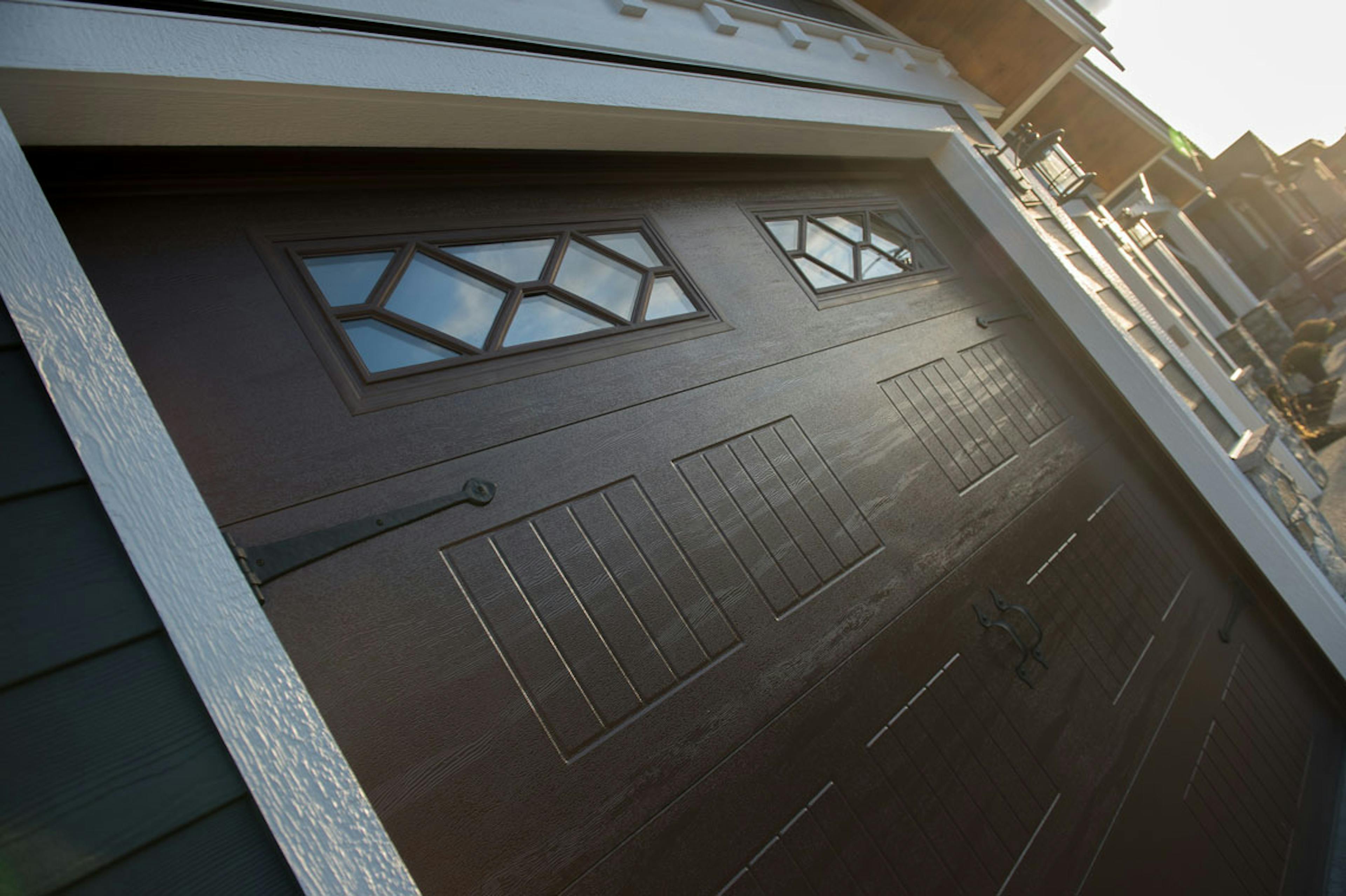 Close-up of dark woodgrain Carriage-Craft garage door