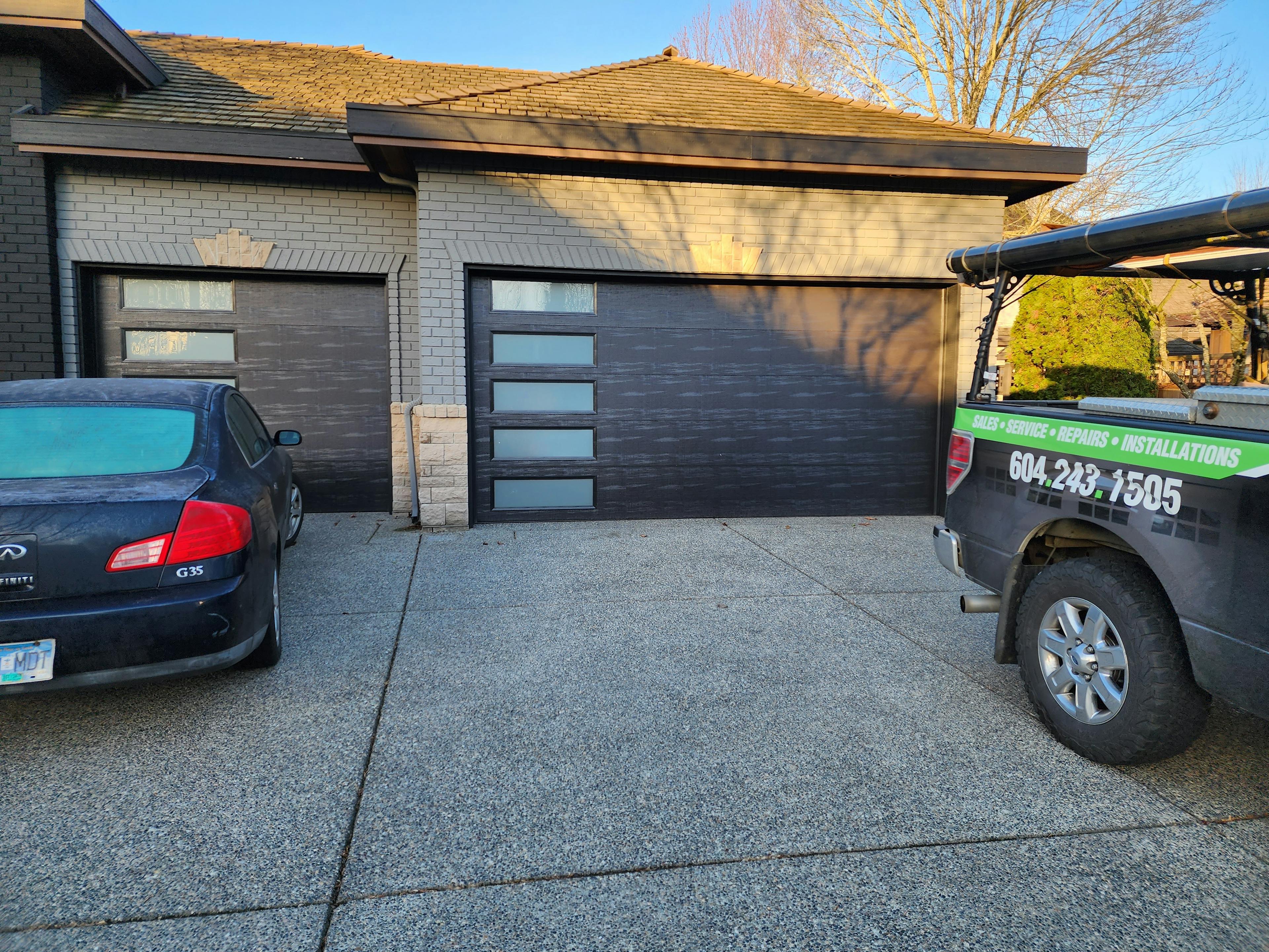 a pair of Amarr Lincoln LI3000 Fully Insulated Flush Panel Garage Doors