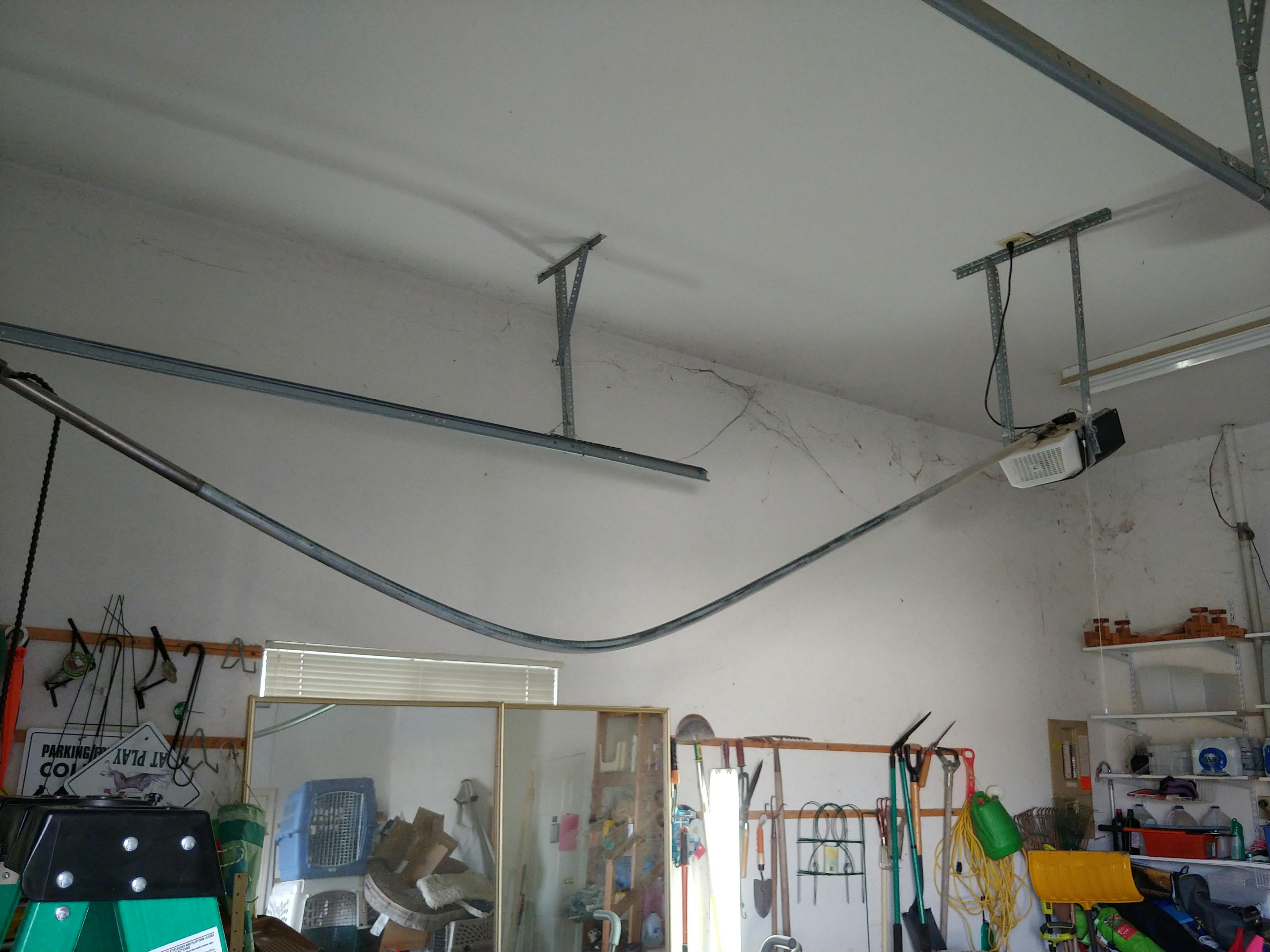 Garage door opener track that is bent