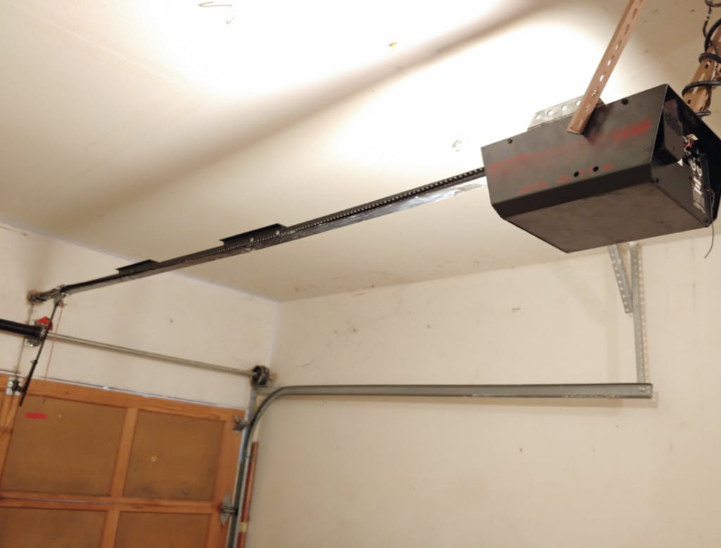 A broken garage door opener in need of repair