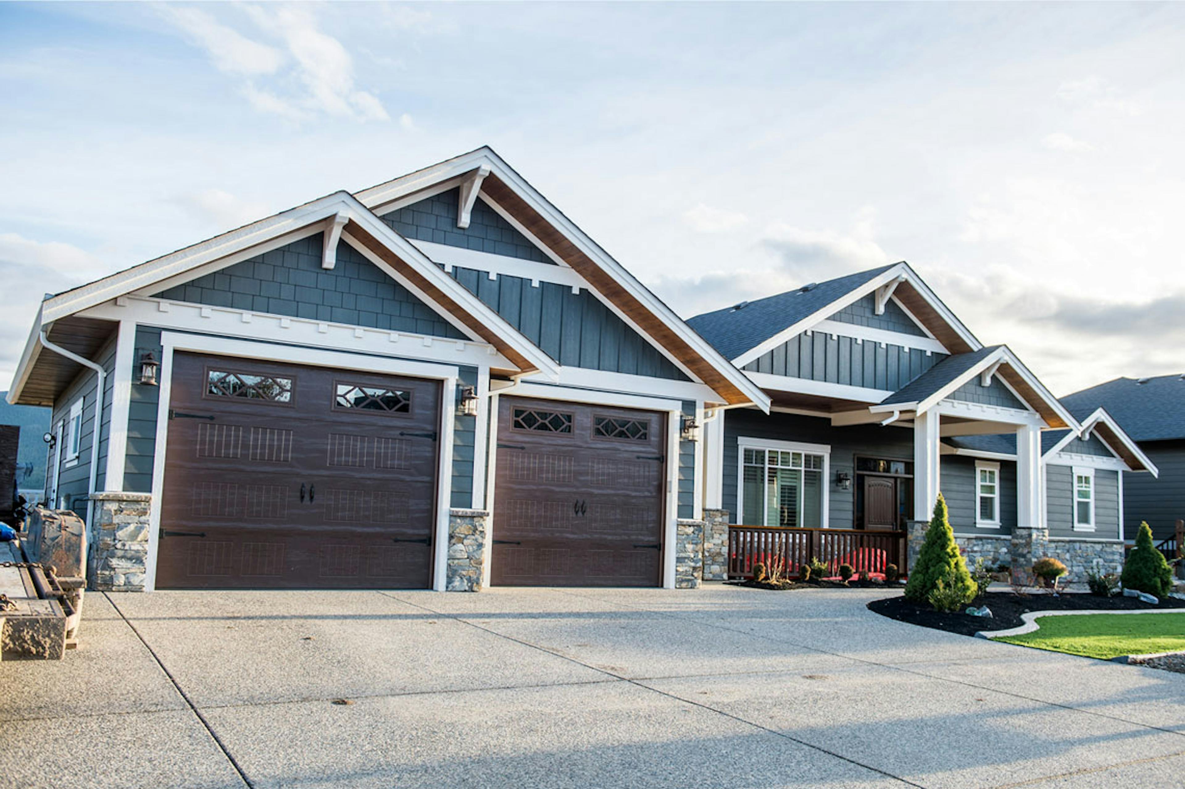 Dark woodgrain Carriage-Craft garage doors