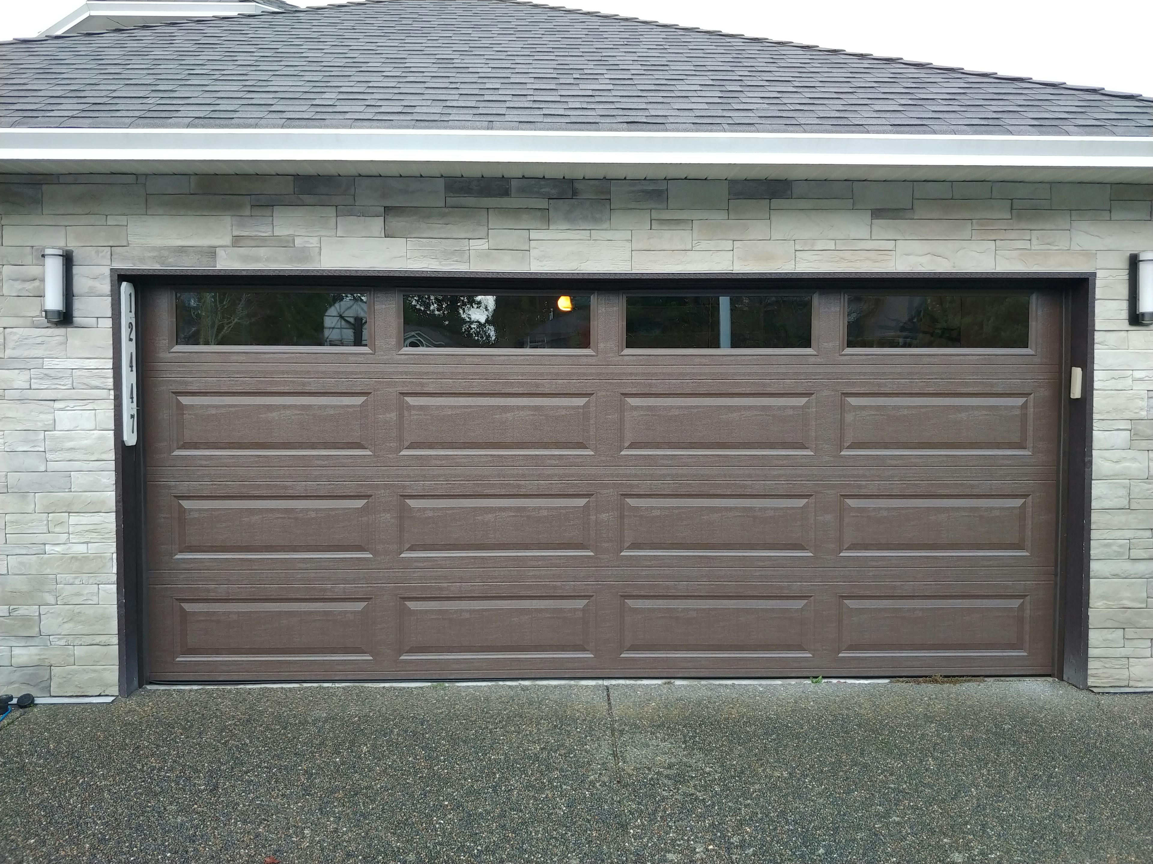 Dark wood grained garage door