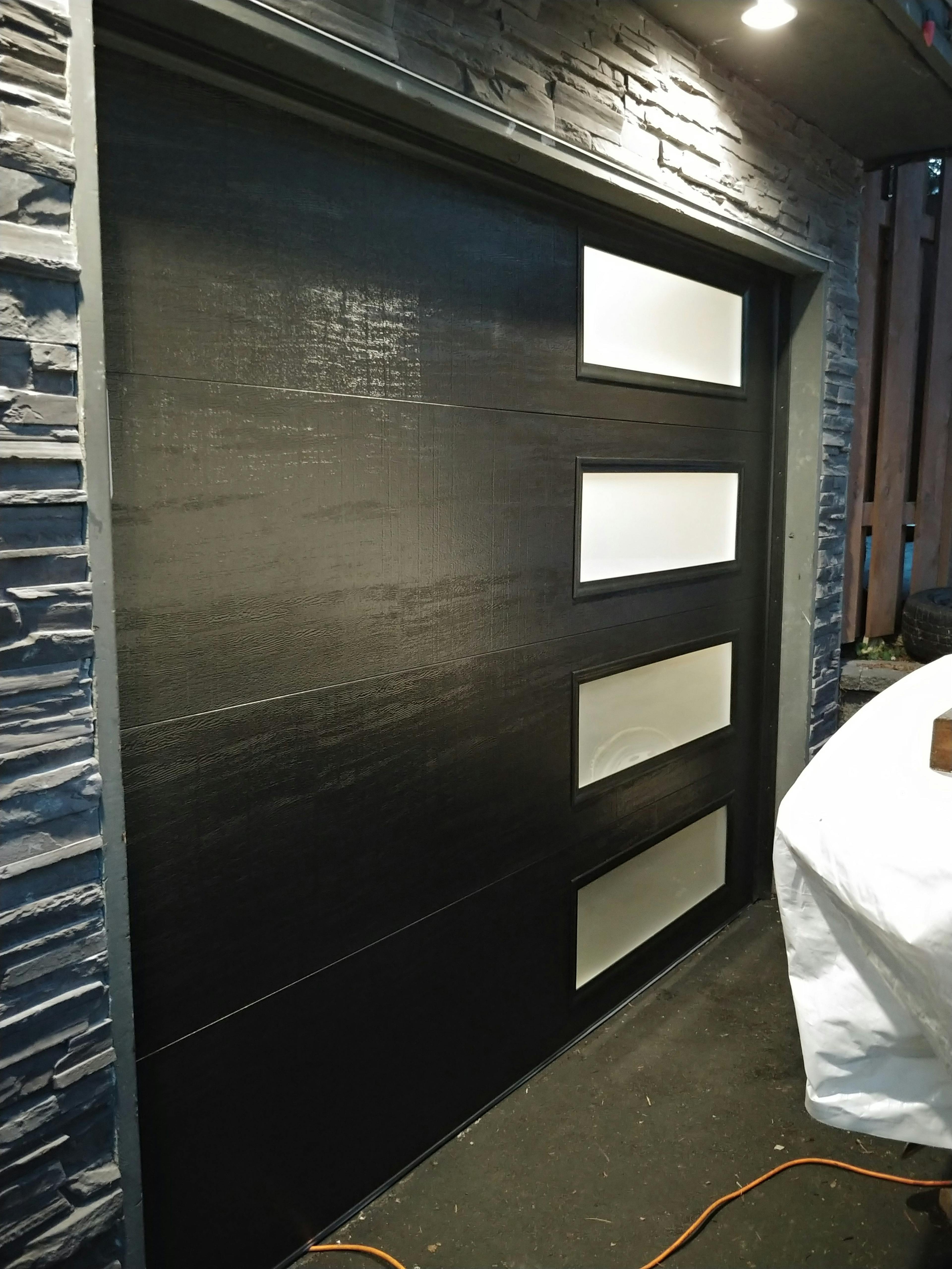 Dark garage door with glass on the right
