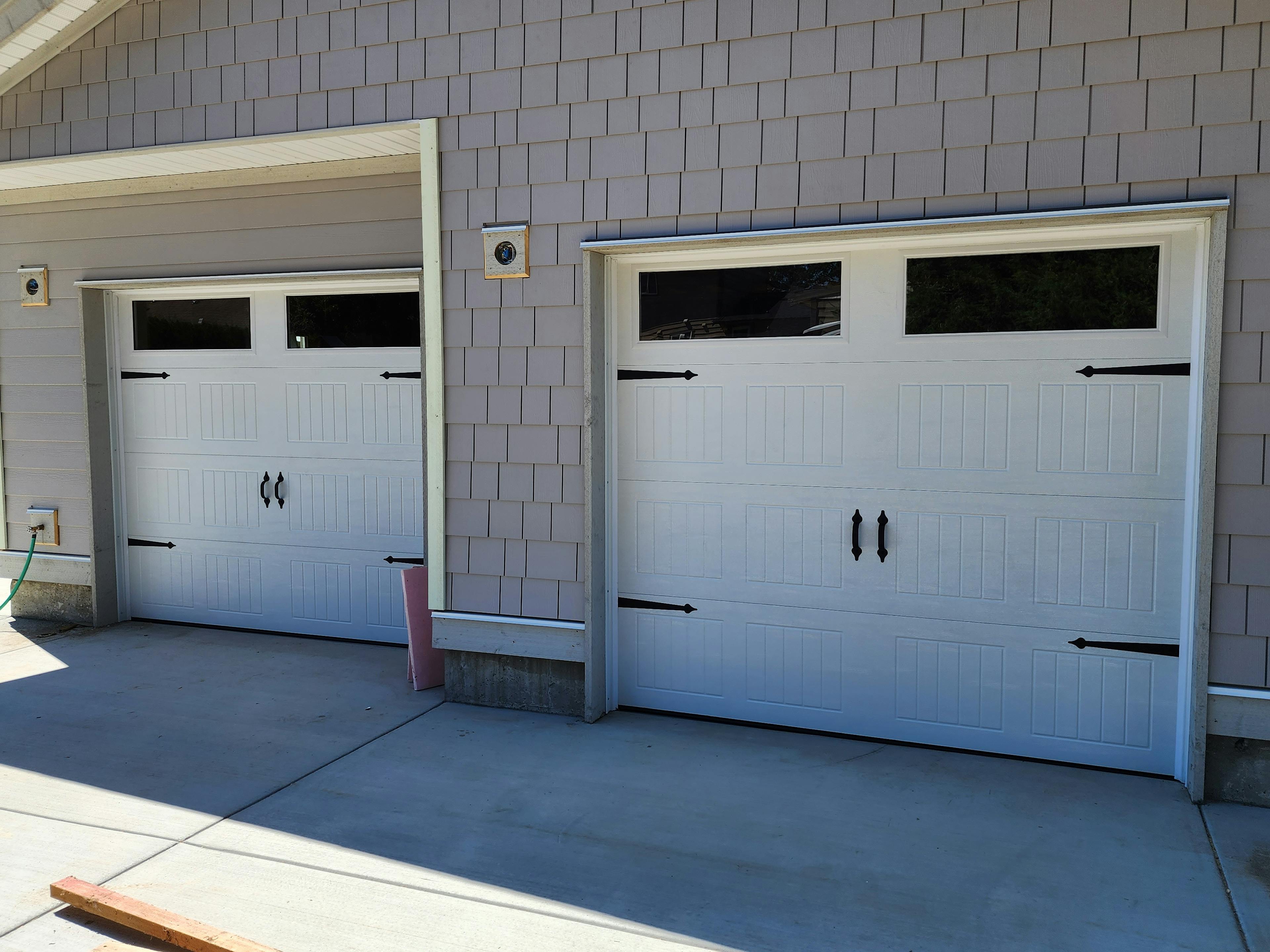  a pair of Steel-Craft R-16 Carriage Panel Garage Doors in Langley