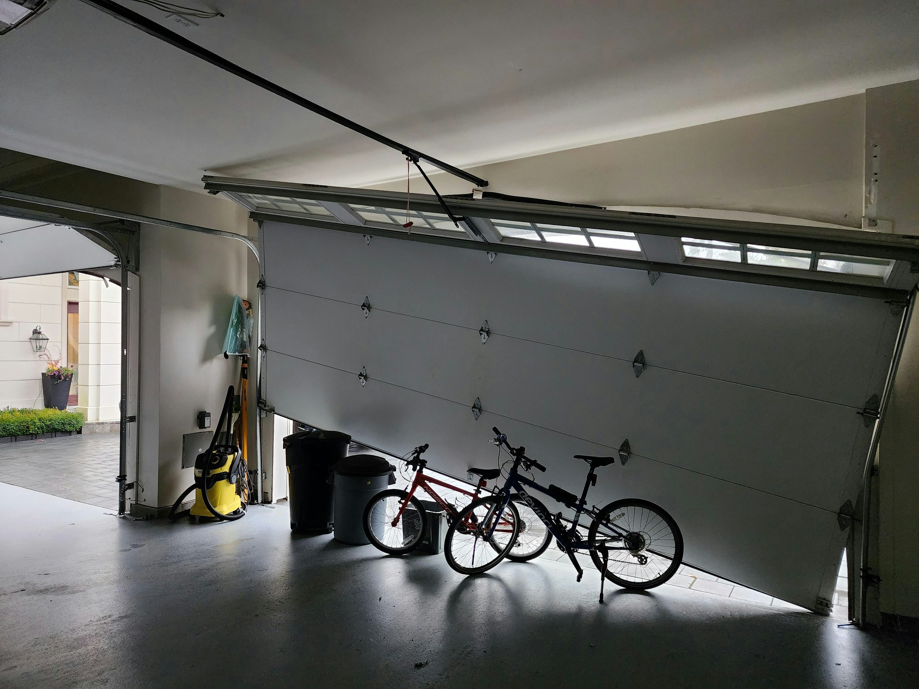 Garage door about to be repaired by Lions Gate Garage Doors (inside view)