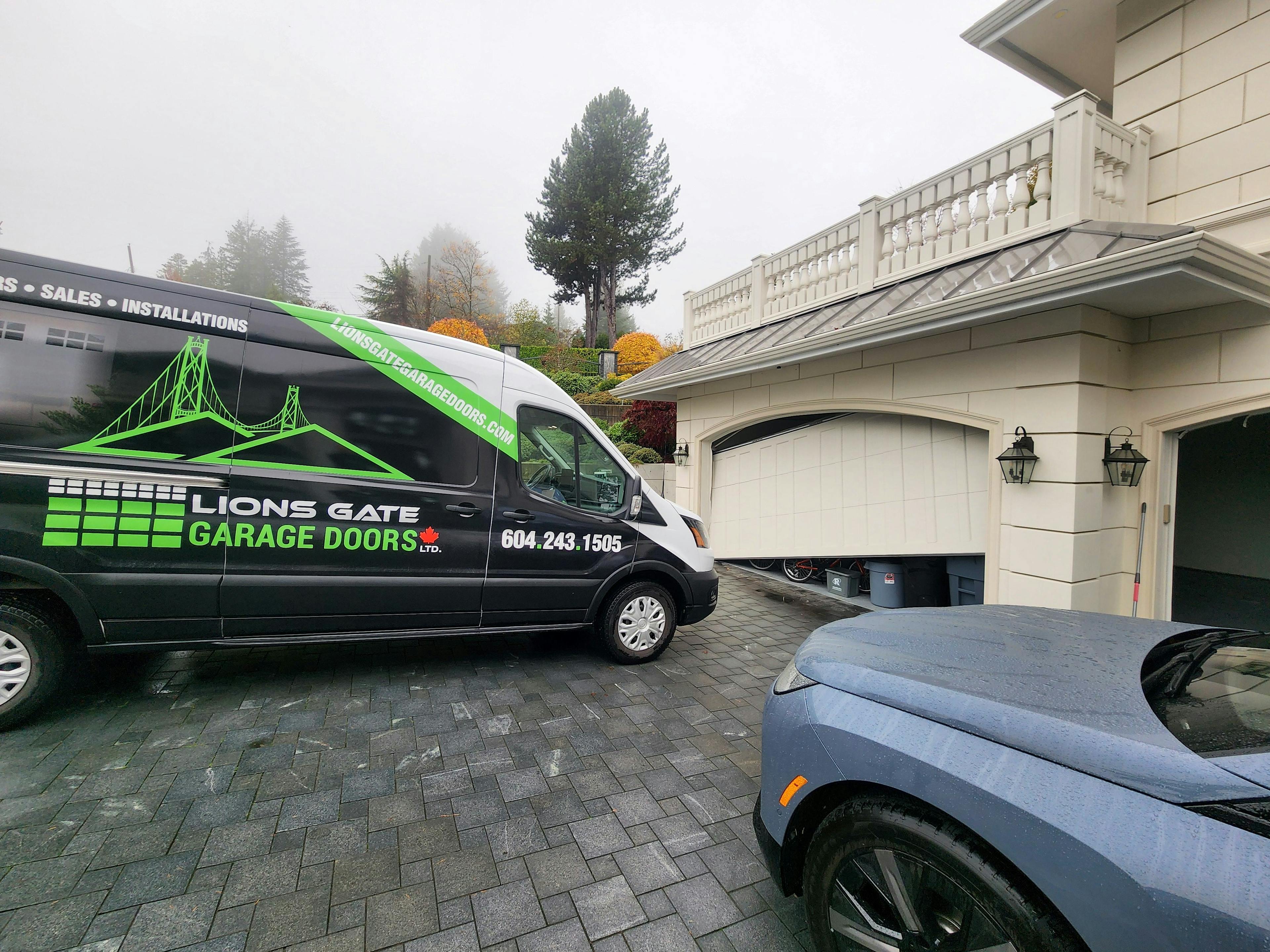 Garage door about to be repaired by Lions Gate Garage Doors (outside view)