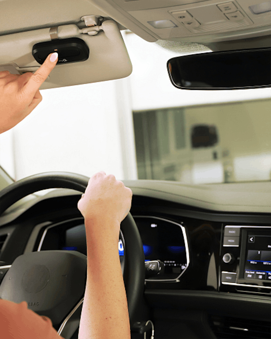 Someone driving and pressing the LiftMaster 1-Button Remote Someone driving and pressing the LiftMaster 1-Button Remote