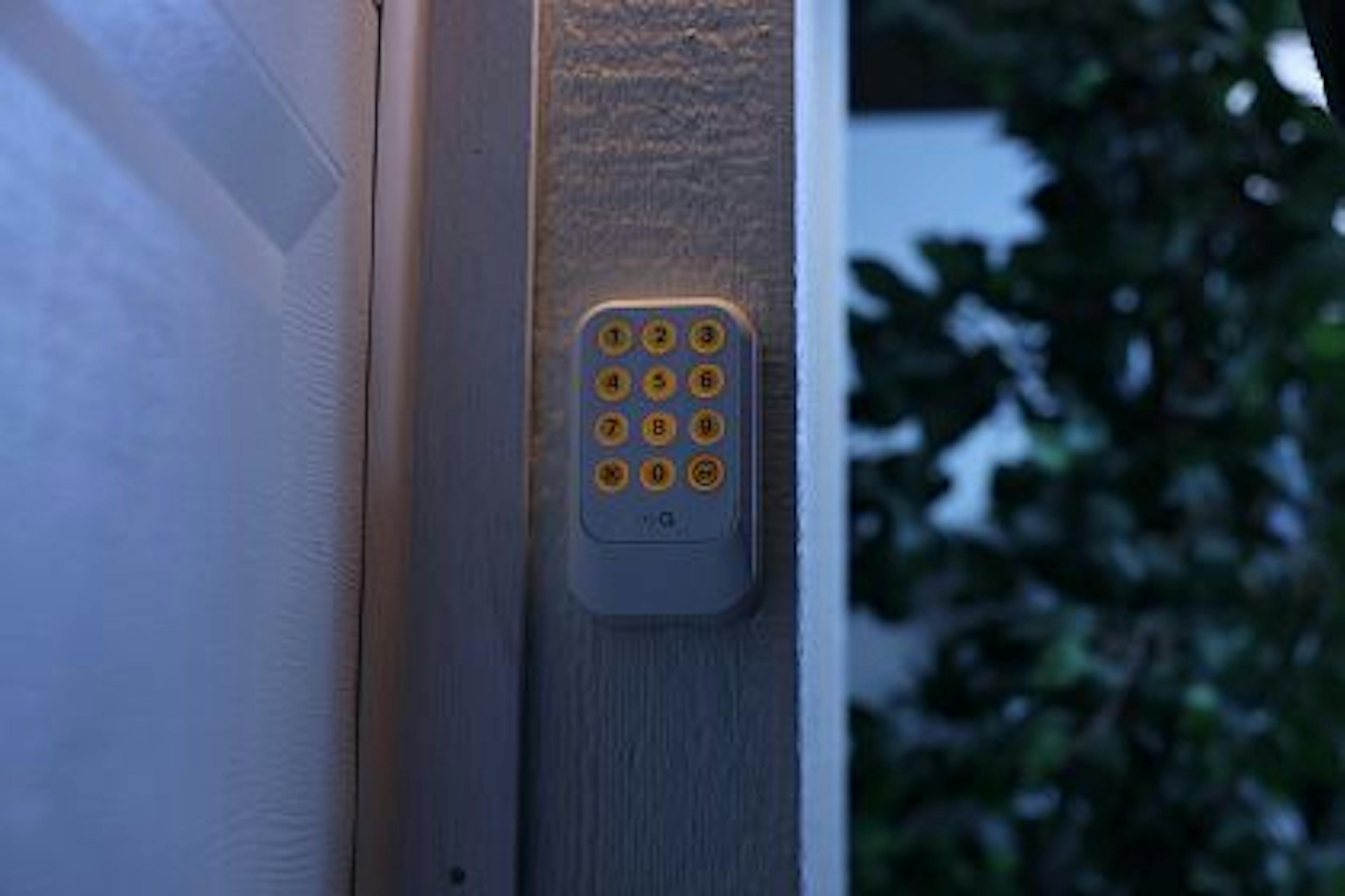 Night view of the illuminated LiftMaster L979S Wireless Keypad