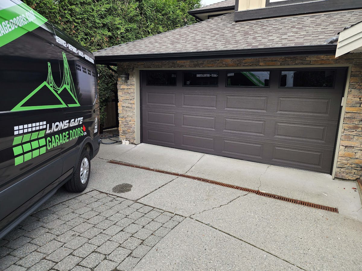 Read Garage Door Installation, Maple Ridge, Portfolio 109 a 16x7 SteelCraft RanchCraft Ridgeline door in Charcoal color with double pane dark tint glass in the top section