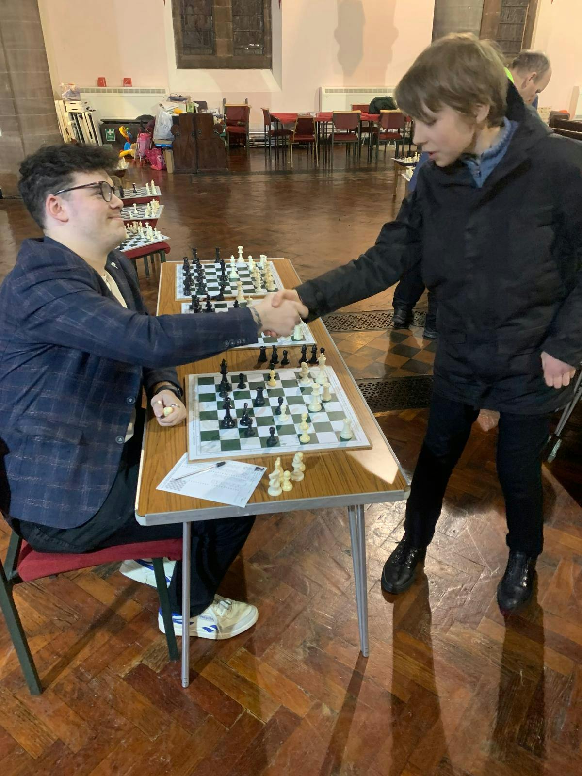 IM Bazakutsa (right) shakes hands with club president Keeghan McGarry (left)... 1-0