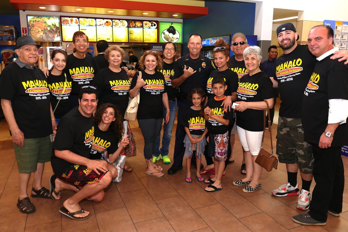 L&L Employees and Customers standing in front of storefront.