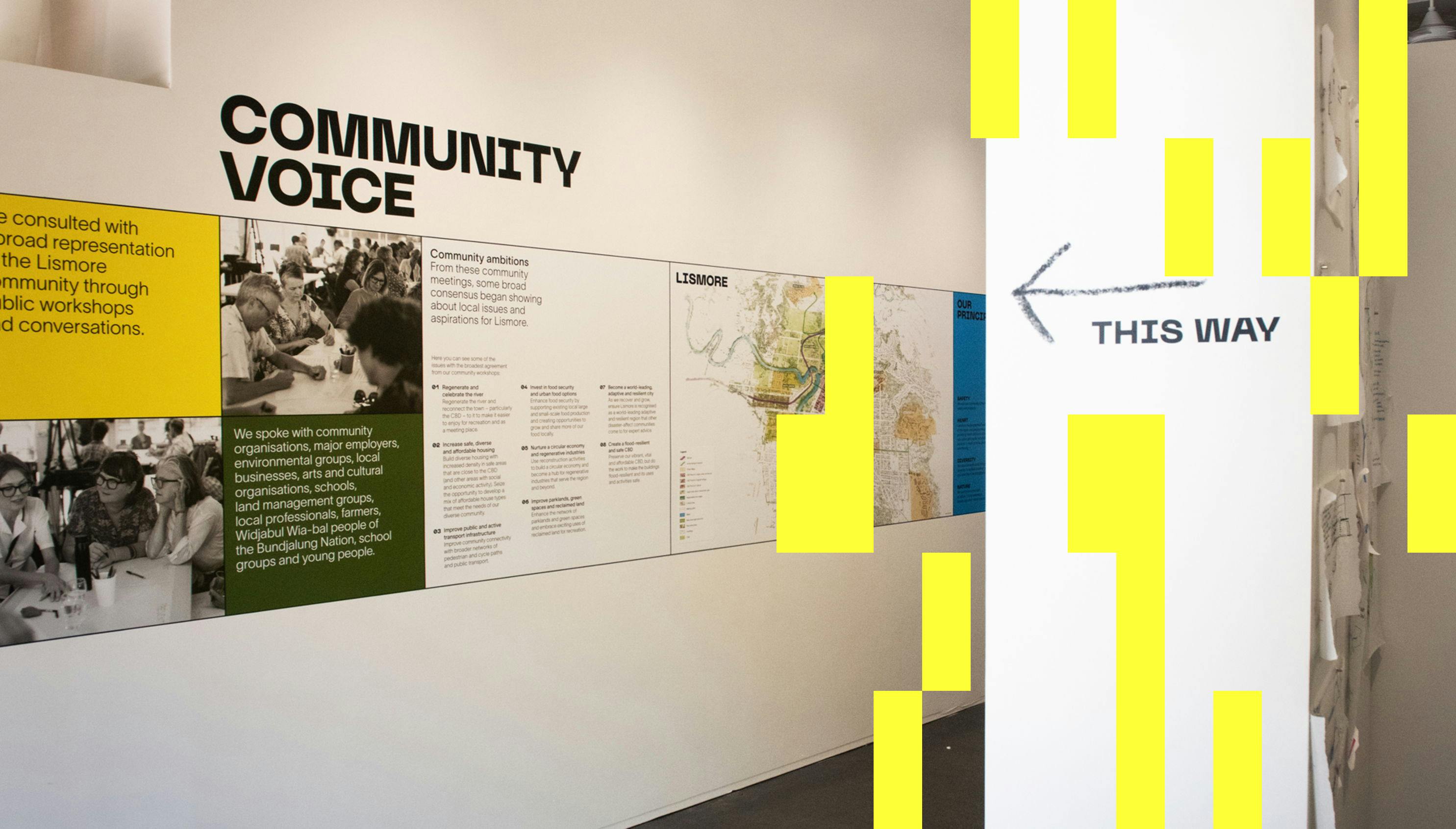 Information and images appear on the wall of the exhibition space, showing the stages of the codesign process.