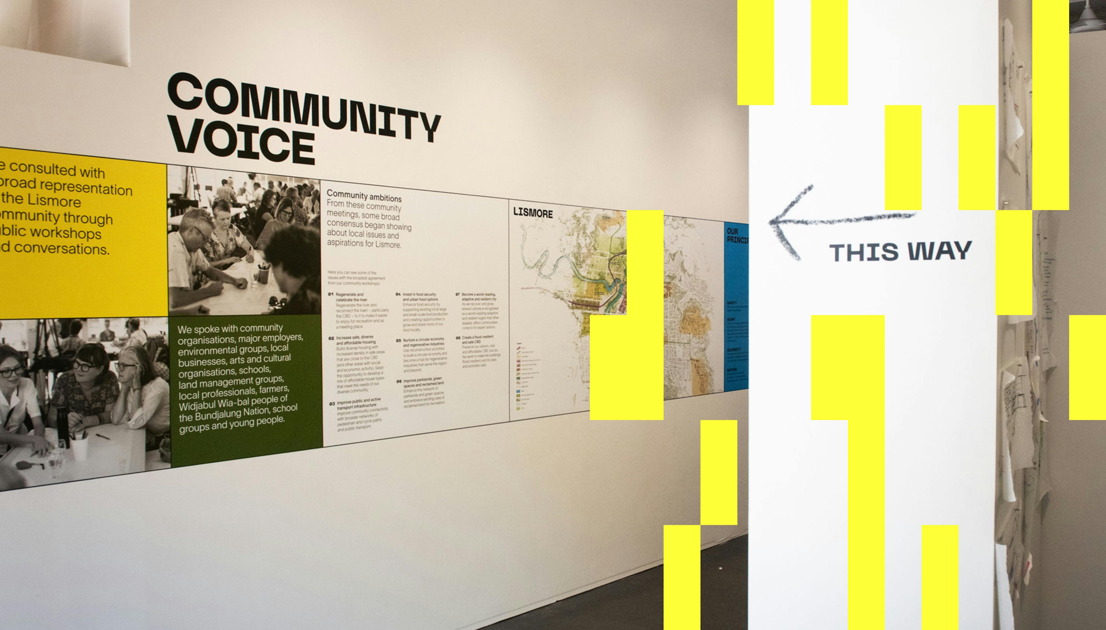 Information and images appear on the wall of the exhibition space, showing the stages of the codesign process.