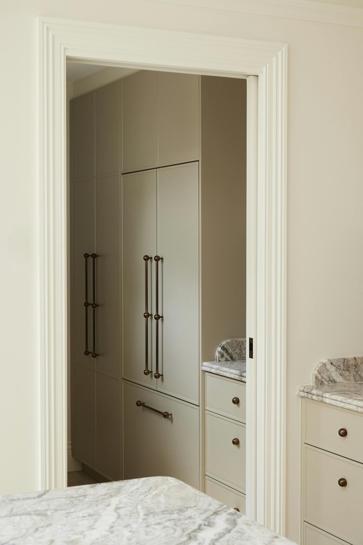 Lo and Co brass handles in a bedroom