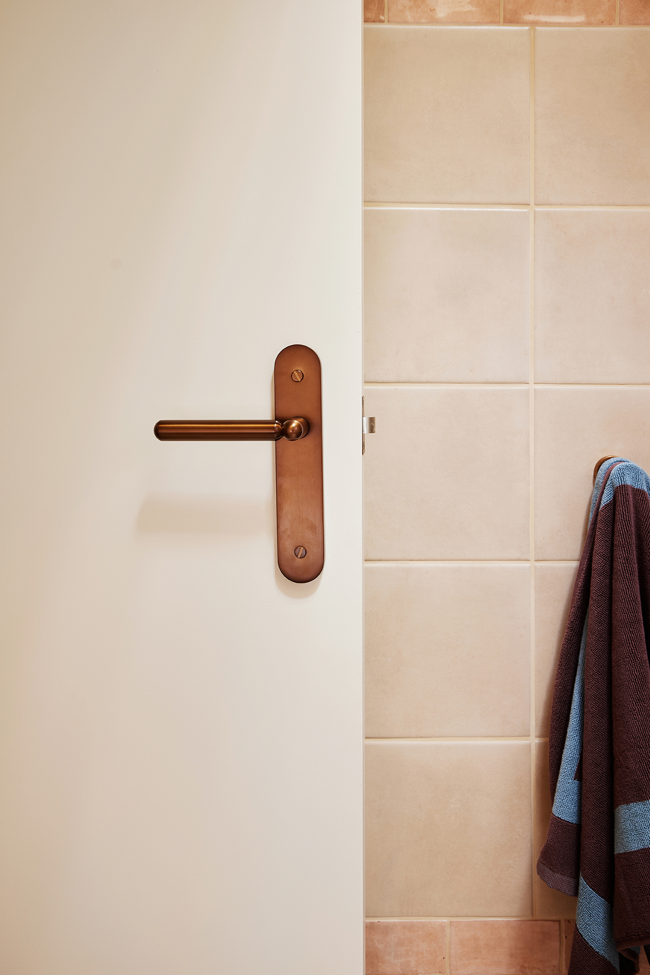 Bathroom with bronze Lo and Co handle door lever