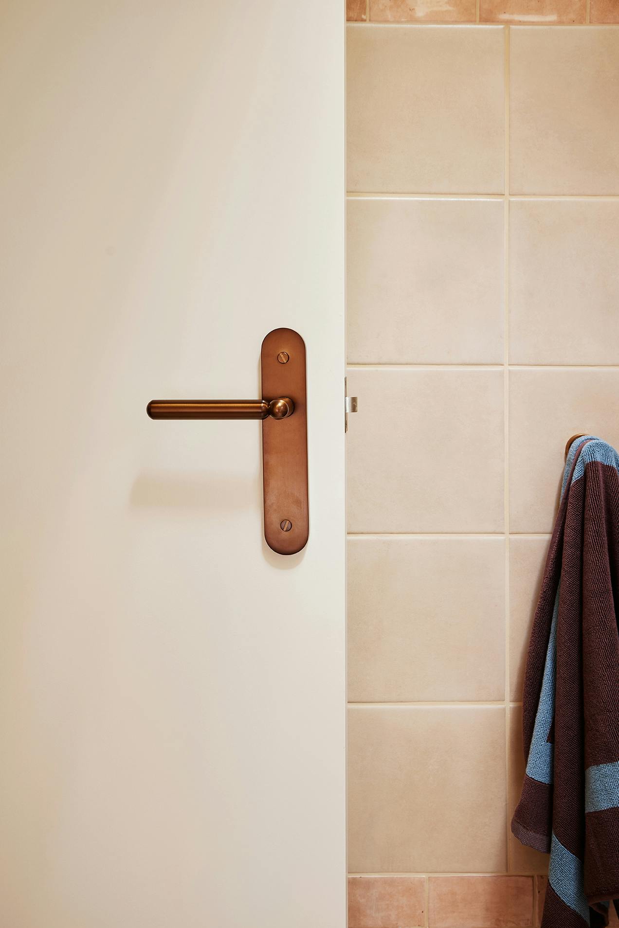 Bathroom with bronze Lo and Co handle door lever