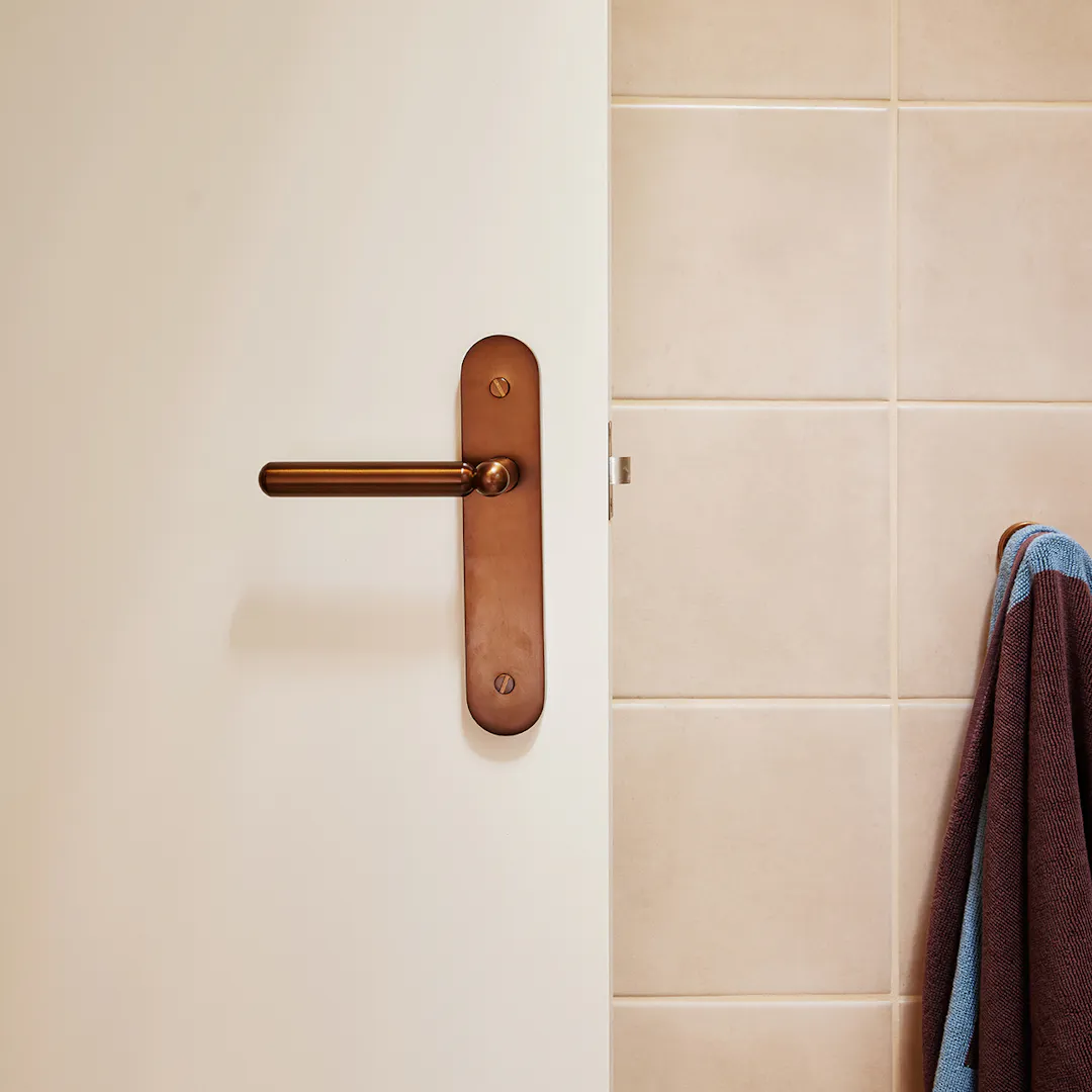 Bathroom with bronze Lo and Co handle door lever