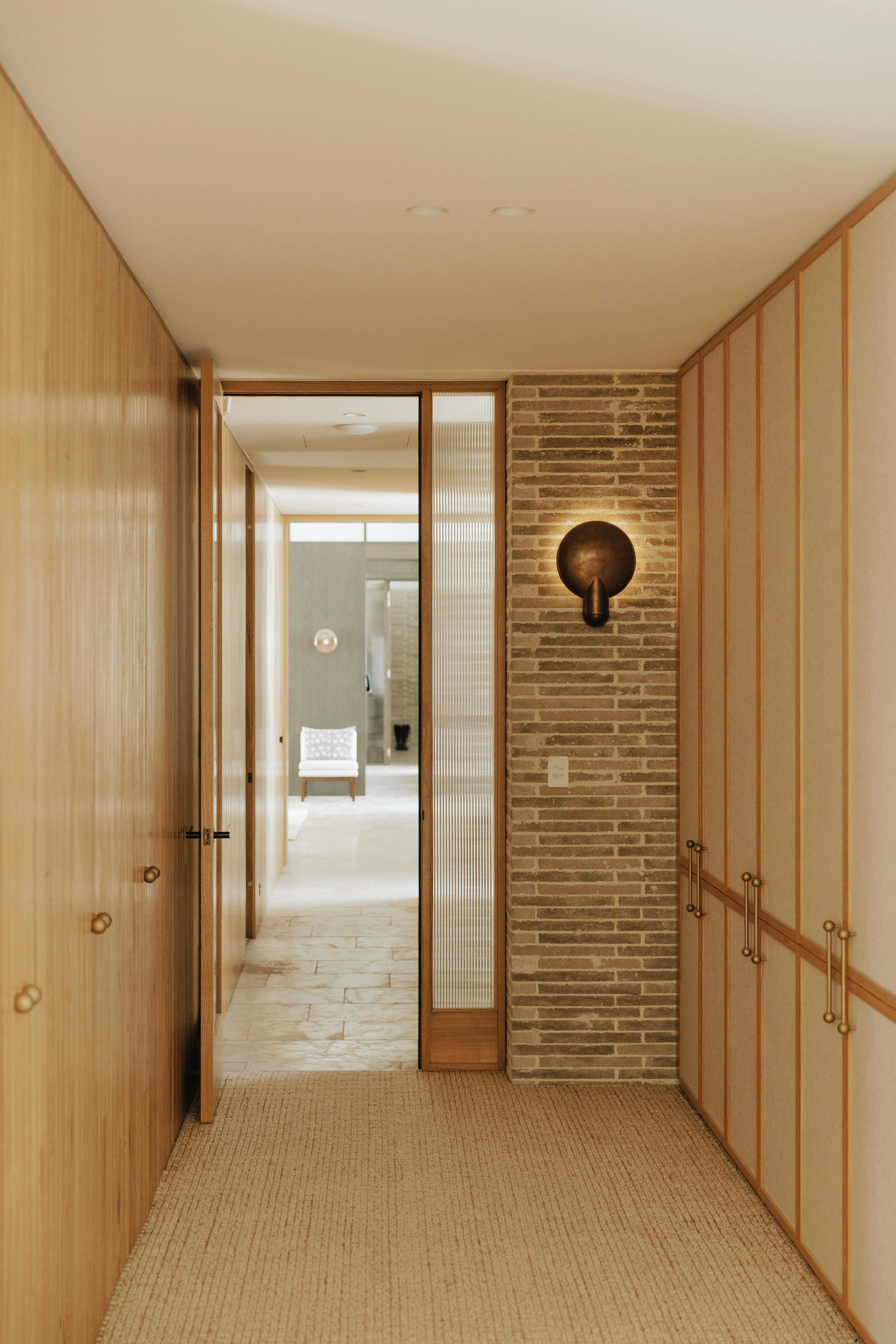 Room with cream cupboard with Lo and Co handles in brass gold