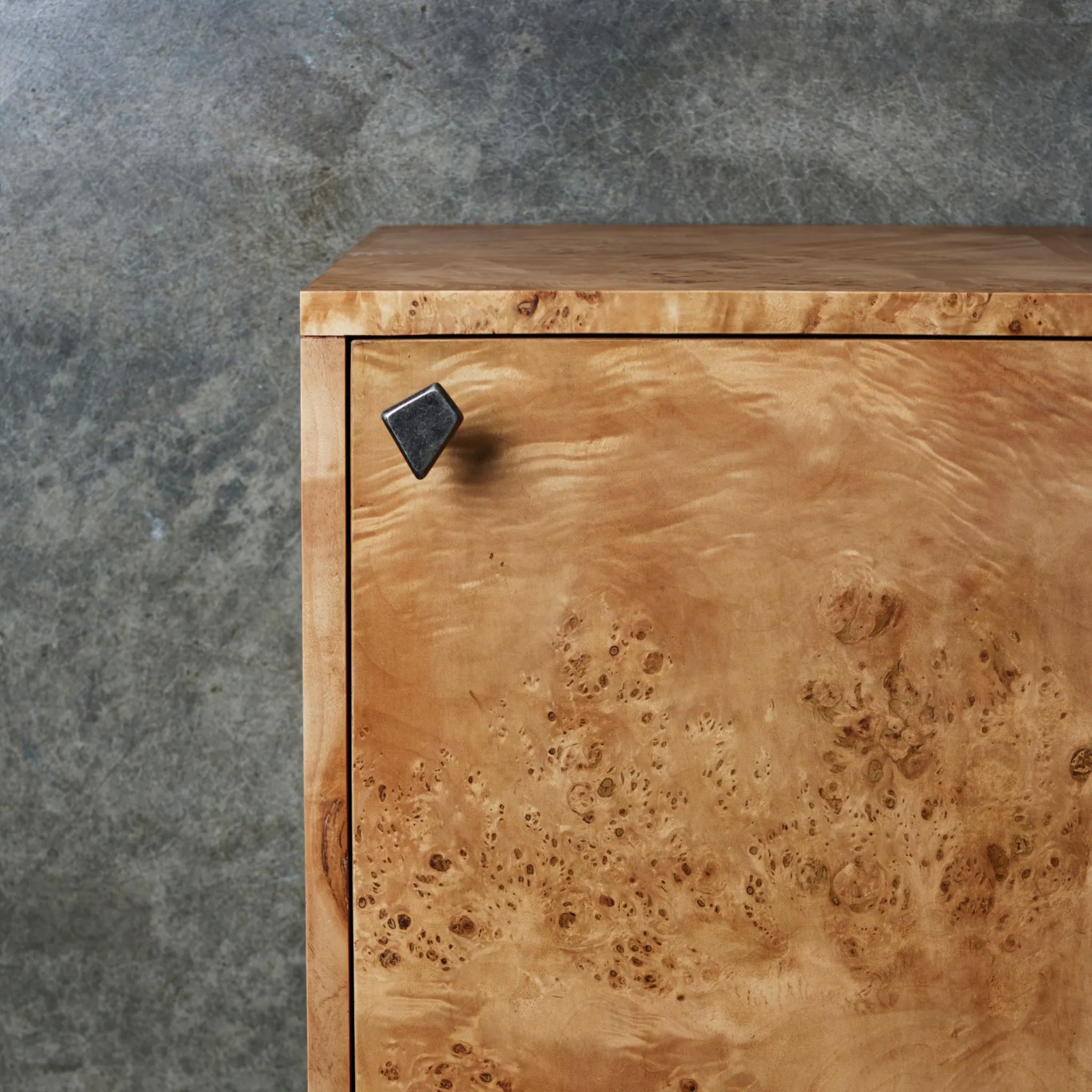 Lo and co outline tumbled nickel knob on a wooden cabinet
