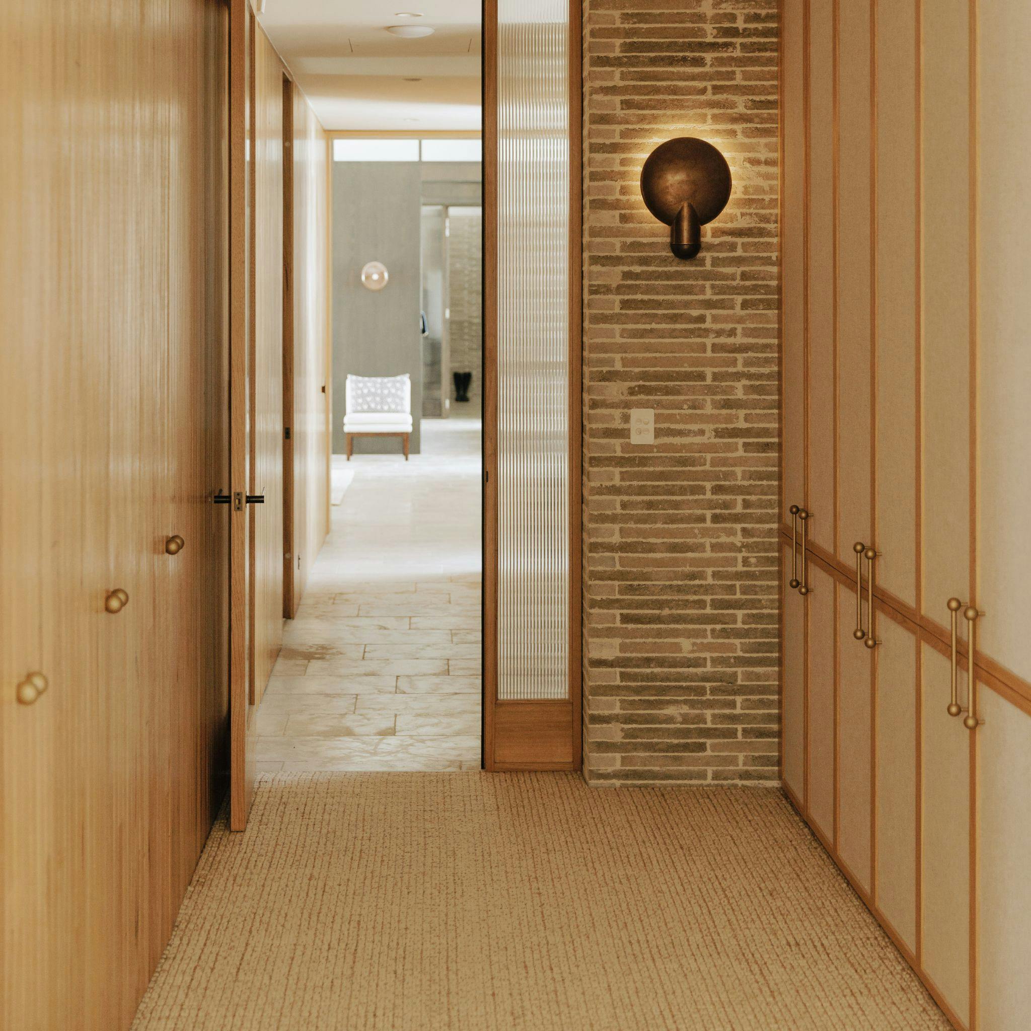 Cabinet with tumbled brass handles