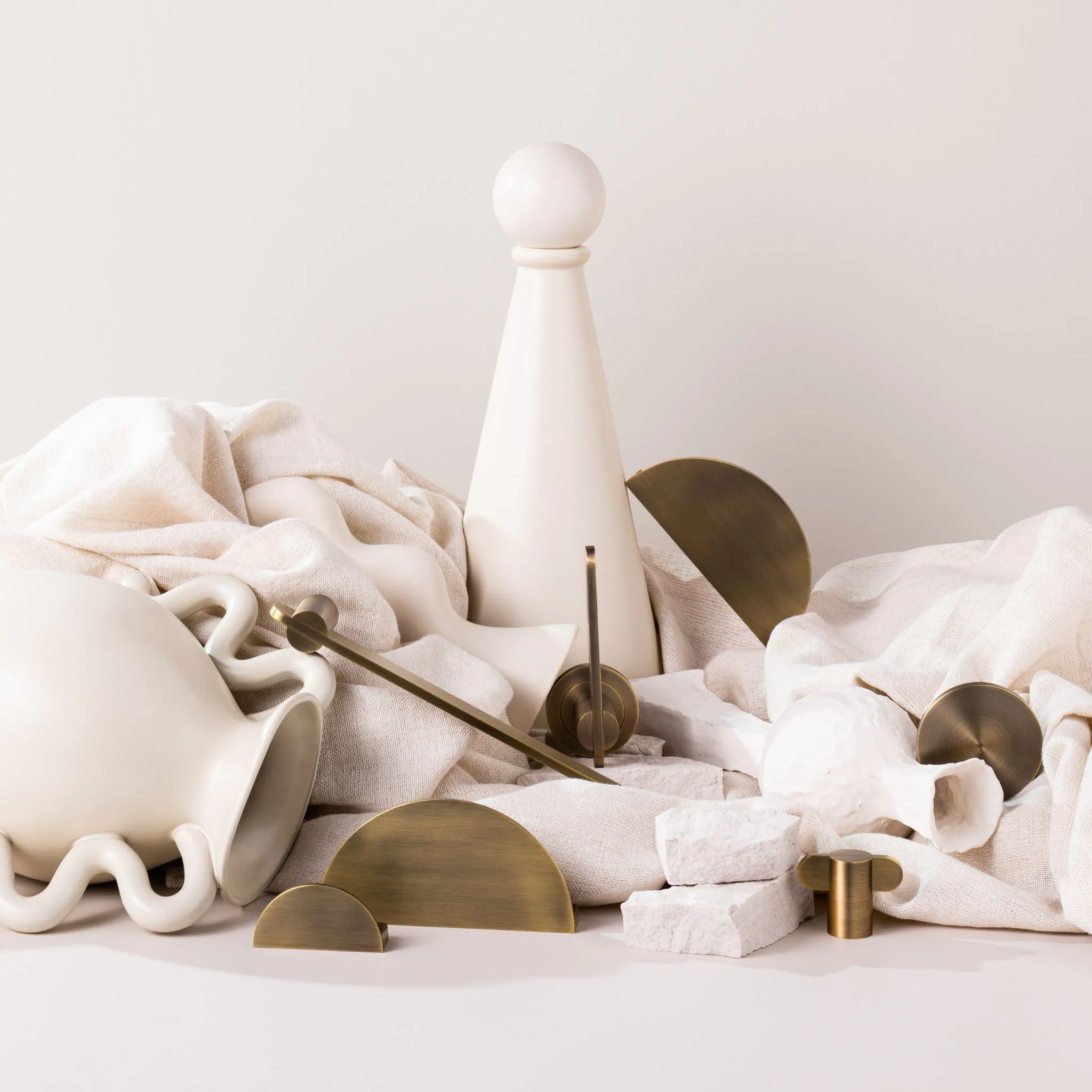 Lo and Co aged brass collection on a white styled backdrop