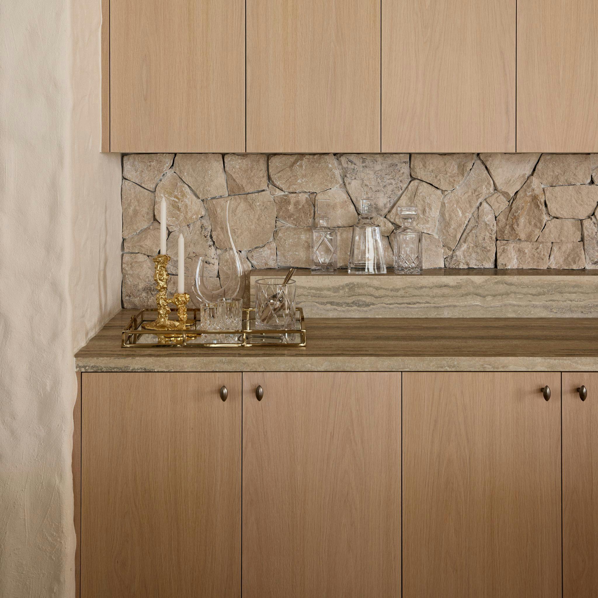 A kitchen with almond shaped knobs on a wooden cabinet