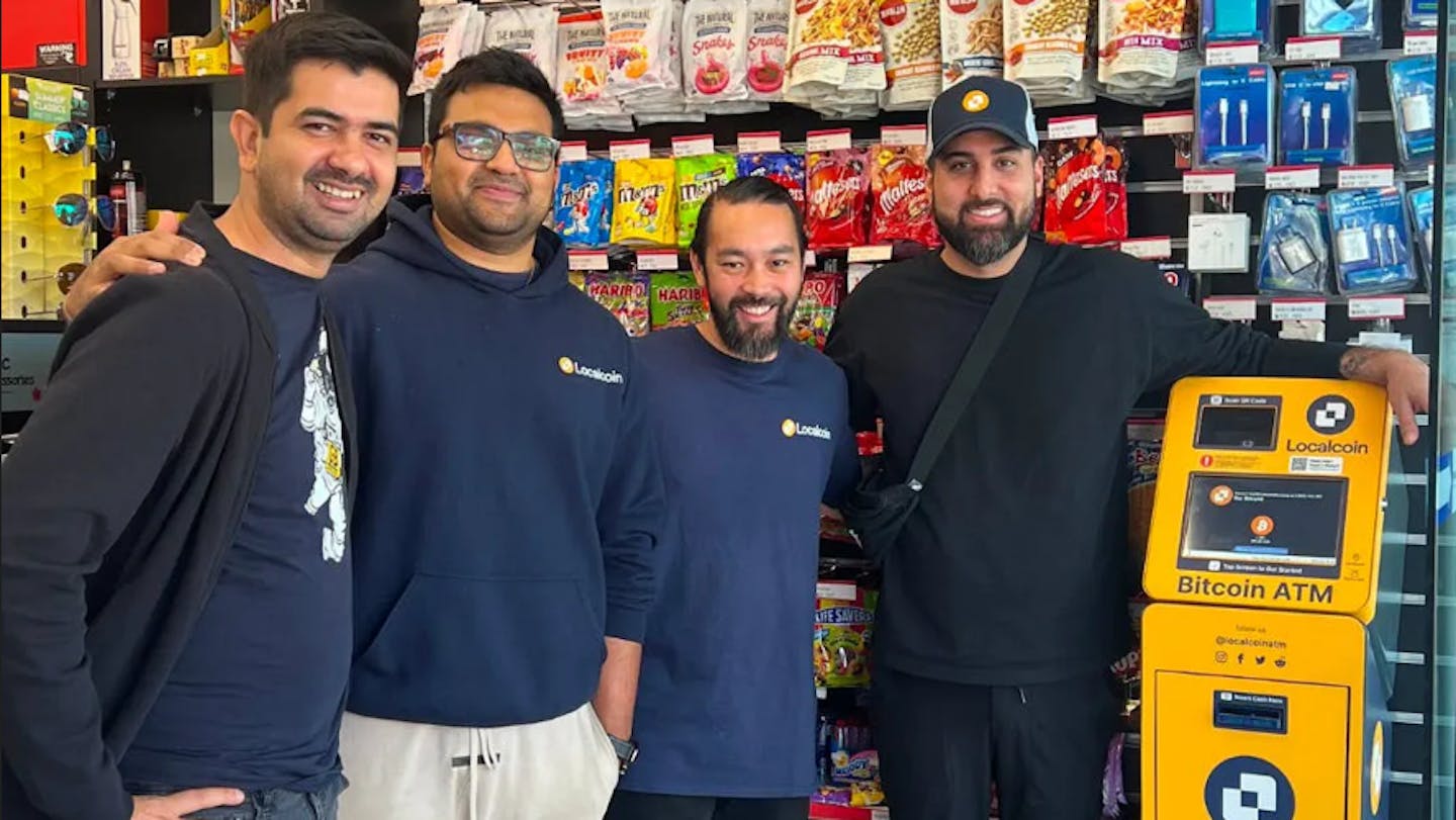 Localcoin employees with newly installed ATM